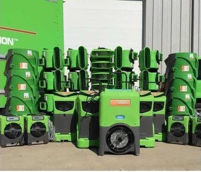 Why SERVPRO In Loudoun County? Image of green SERVPRO equipment.